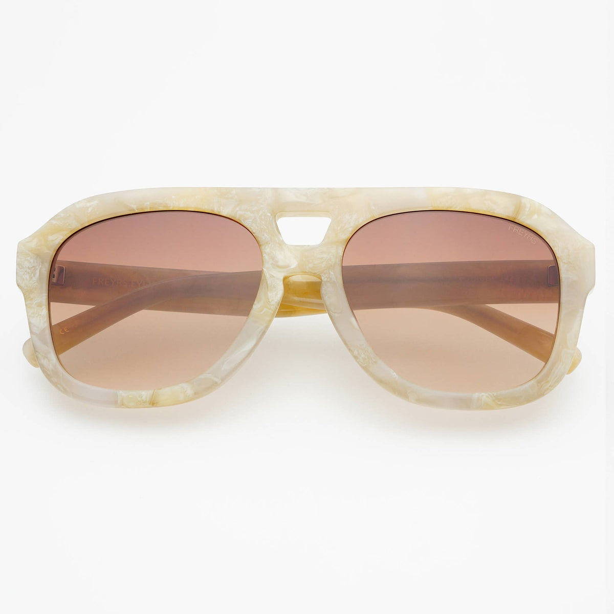 Sunglasses with beige frame and brown lenses on a white background