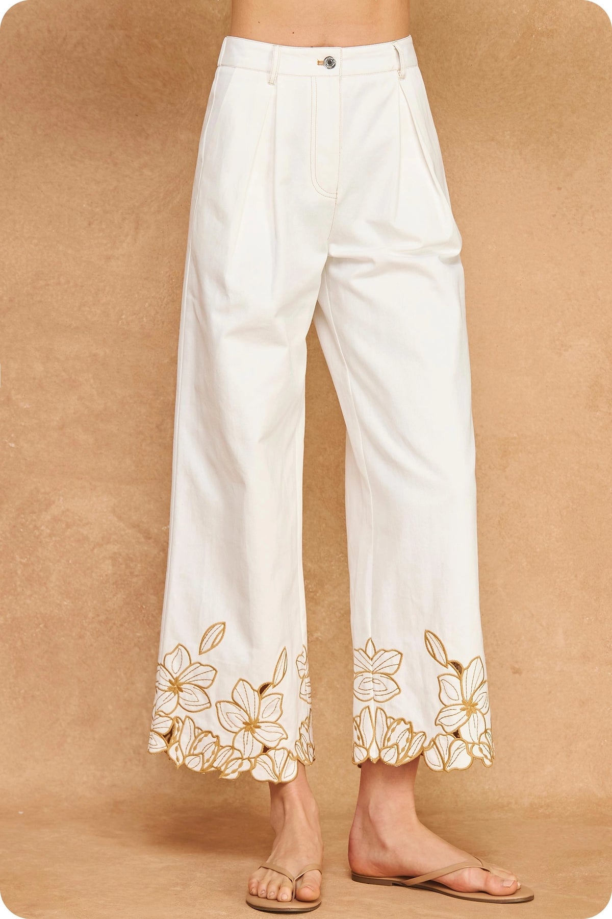 Strut & Bolt off-white cropped wide-leg twill pants with sand floral cut-out embroidery at the hems.